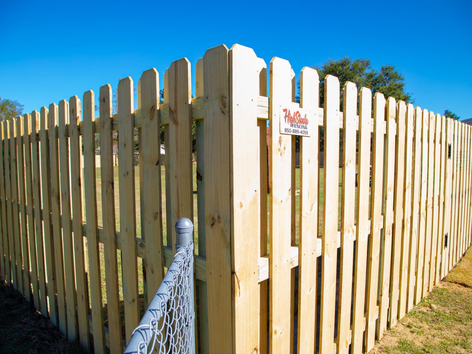 Photo of a wood fence from the outside corner view
